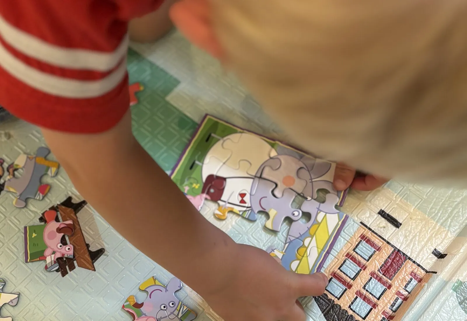 A child playing with a puzzle in creche.