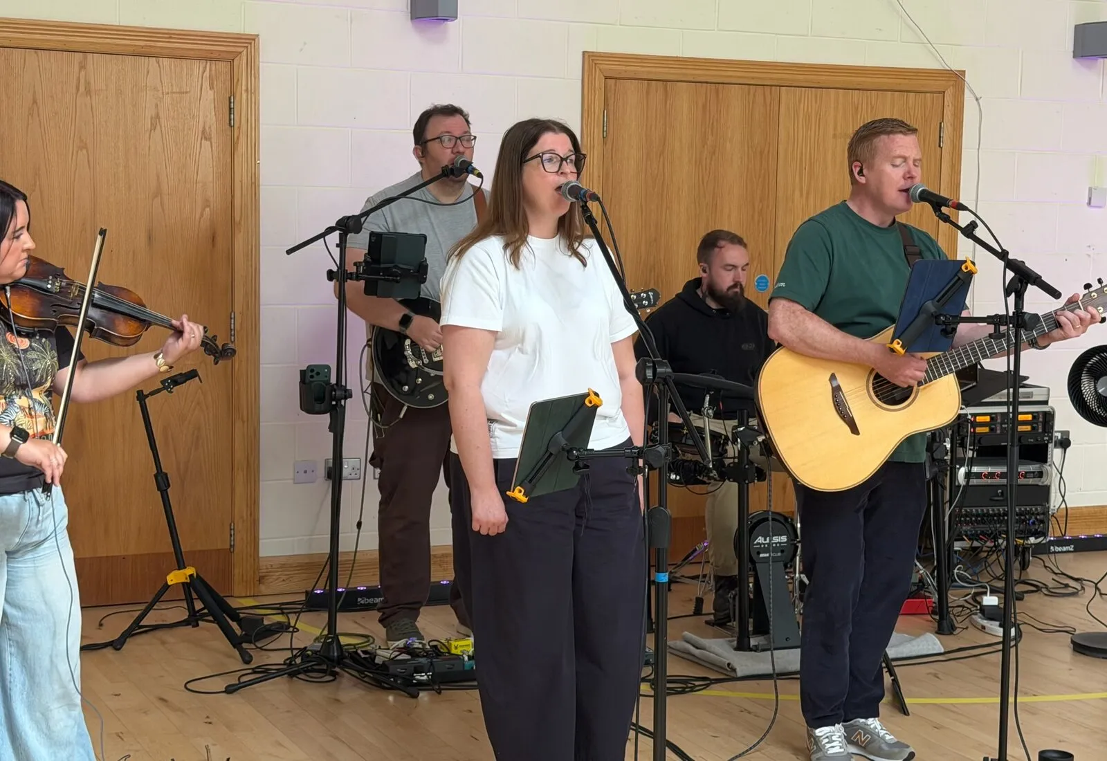 The worship team leading music during a Sunday service at Millbrook.