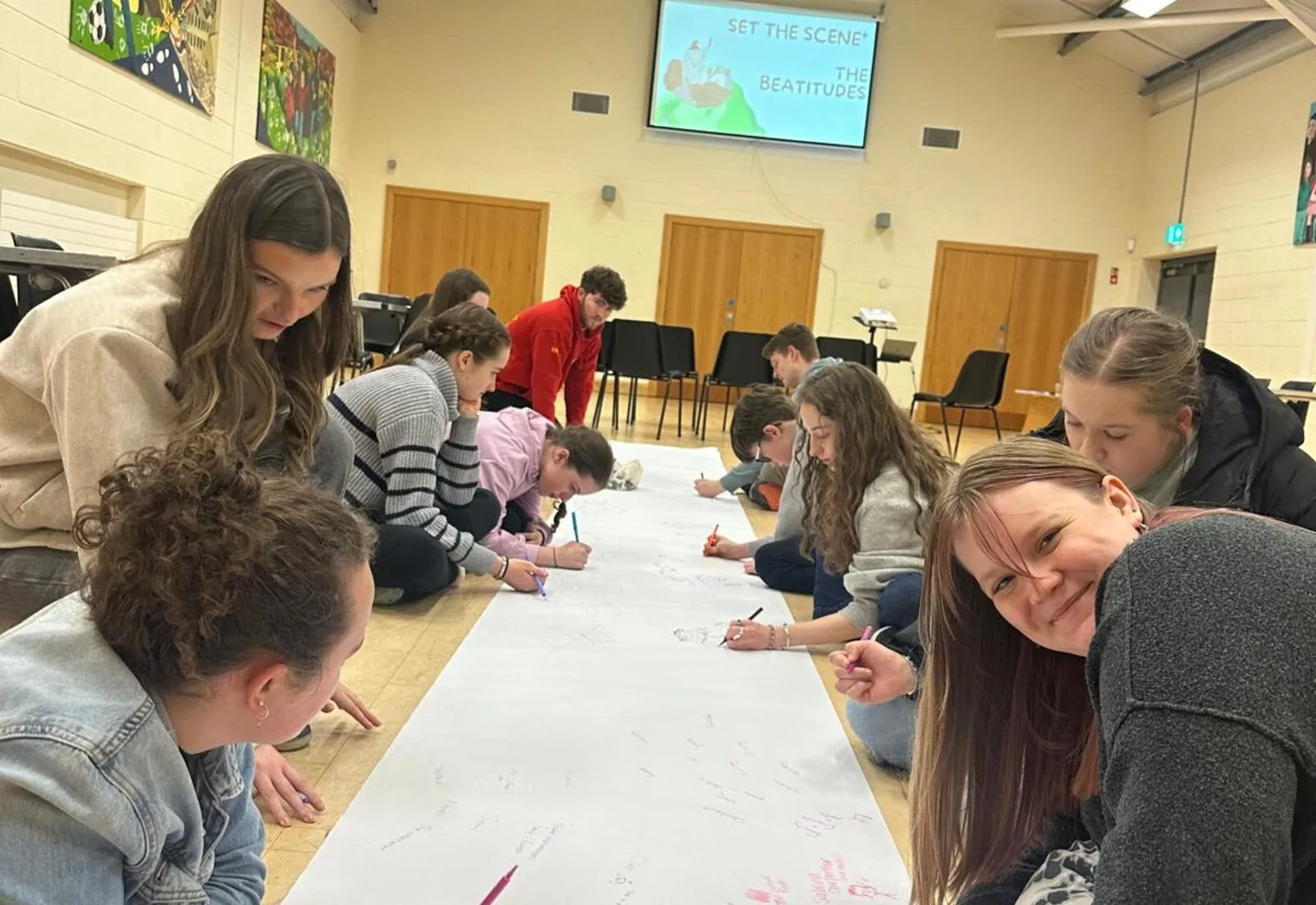 Young people taking part in an interactive youth activity.